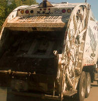 Garbage truck with a great slogan